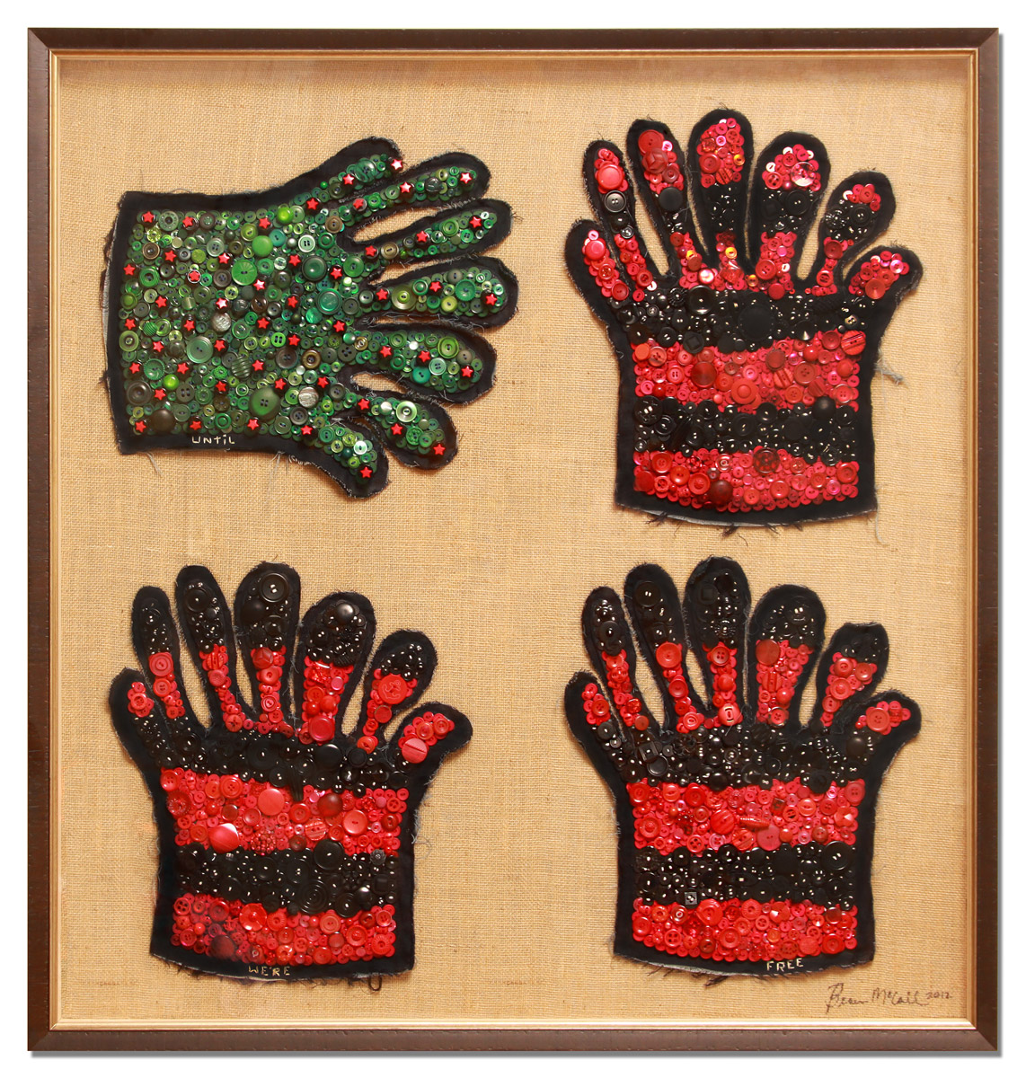 Colorful button-and-bead glove artwork in a gold frame